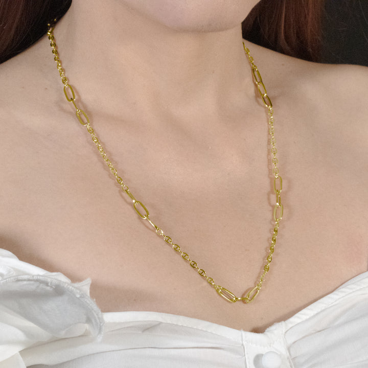 Model showcasing the elegance of a Mariner Chain necklace adorned with stylish paperclip links