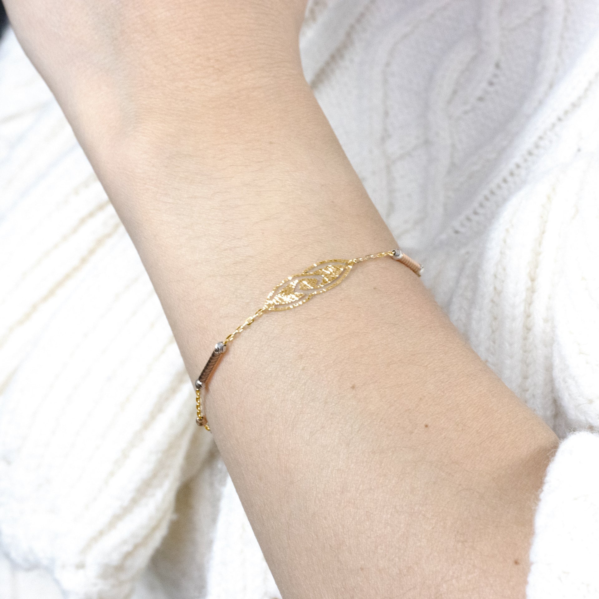 Worn chain bracelet featuring a leaf-link design for a stylish and nature-inspired look