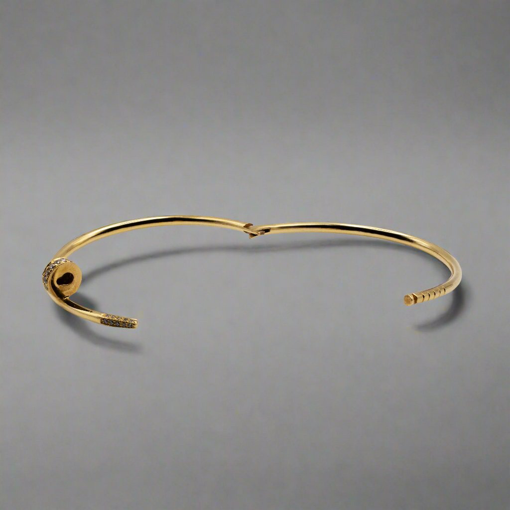 A closer look at an unlocked hinge bangle, highlighting its intricate lock design