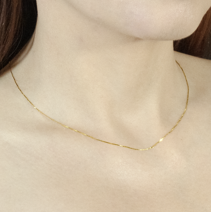 a shot of the box chain necklace worn to show it's actual size and length.